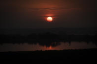 The sun sets over Murchison Falls National Park, northwest Uganda, on Feb. 21, 2020. The East Africa Crude Oil Pipeline, a controversial oil project that would connect oilfields in the park to a port in Tanzania is in breach of global environmental and human rights guidelines for banks, according to a new report by Inclusive Development International on Tuesday, July 5. (AP Photo)