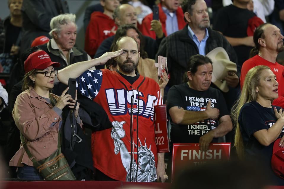 <p>A man at a Trump rally in El Paso salutes. </p>