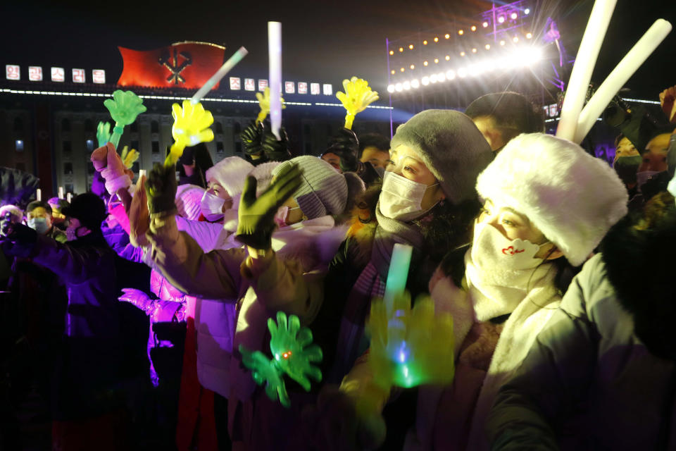 Citizens enjoy the New Year's performance on Kim Il Sung Square in Pyongyang, North Korea, Saturday, Jan. 1, 2022. (AP Photo/Cha Song Ho)