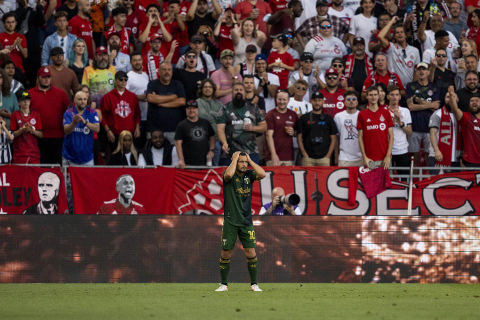 Portland Timbers midfielder Sebastián Blanco (10) reacts after not getting a call during the first half of an MLS soccer match against Toronto FC in Toronto on Saturday, Aug. 13, 2022. (Andrew Lahodynskyj/The Canadian Press via AP)