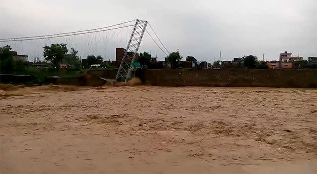 The bridge over the Tinau River collapses into the floodwater. Photo: Supplied