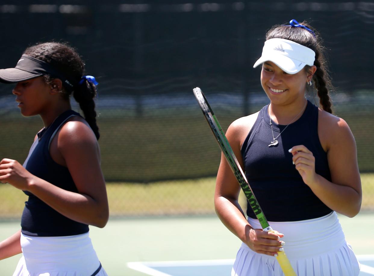 Heritage Hall's Jasmine Crain smiles next to partner Tokara Henderson in the 5A No. 1 doubles match during the high school state girls tennis tournament at the OKC Tennis Center in Oklahoma City, Friday, May, 5, 2023. 