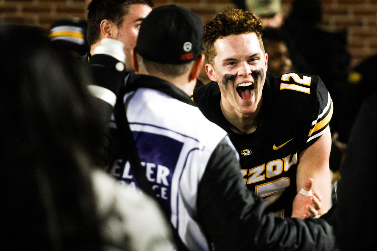 Missouri quarterback Brady Cook shares his elation after defeating Florida 33-31 in a college football game at Memorial Stadium on Nov. 18, 2023, in Columbia, Mo.