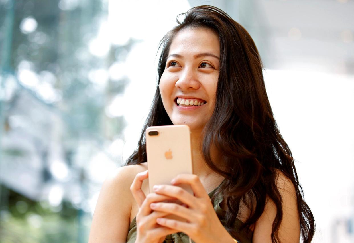 A woman holds Apple's new iPhone 8 Plus after it went on sale at the Apple Store in Tokyo's Omotesando shopping district, Japan, September 22, 2017: REUTERS/Issei Kato