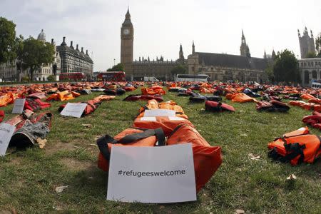 A display of lifejackets worn by refugees during their crossing from Turkey to the Greek island of Chois, are seen Parliament Square in central London, Britain September 19, 2016. REUTERS/Stefan Wermuth