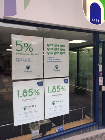 Advertising posters of the Hanley Economic Building Society are seen placed on a window at their branch in Stoke-on-Trent