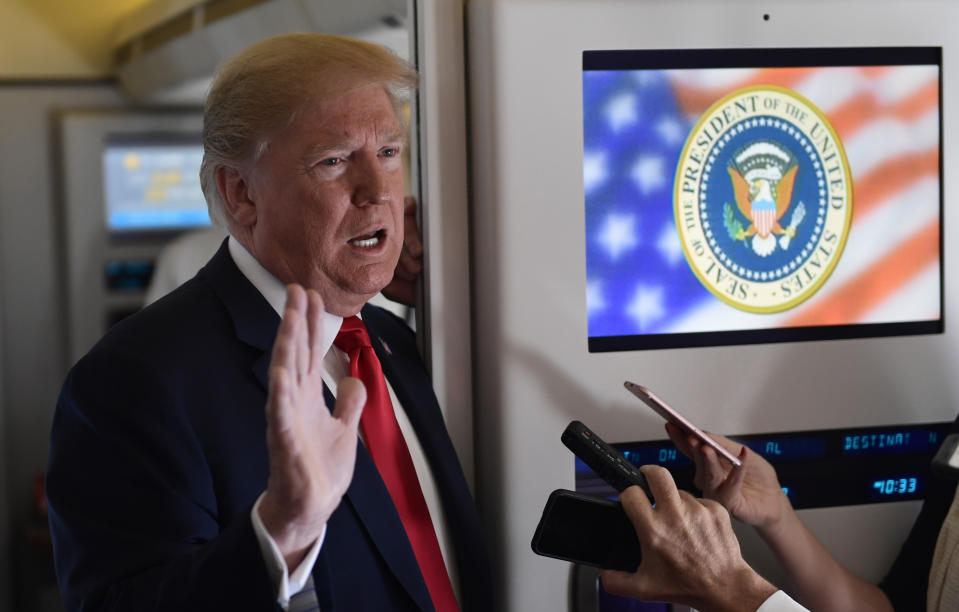 President Donald Trump talks to reporters while in flight from Billings, Mont., to Fargo, N.D., Friday, Sept. 7, 2018. (AP Photo/Susan Walsh)