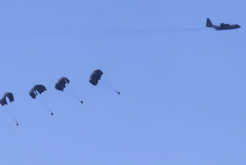 A U.S. Air Force C-130 drops humanitarian aid in Gaza earlier this month. On Thursday, the U.S. Central Command and Royal Jordanian Air Force successfully conducted food drops into northern Gaza. Photo by Jim Hollander/UPI