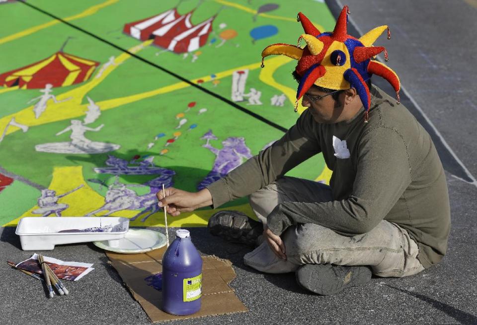 Anthony Cappetto, of New York, NY., works on his pavement art project during the Sarasota Chalk Festival Wednesday, Oct. 31, 2012, in Sarasota, Fla. The annual festival begins this week and runs through Nov. 6.(AP Photo/Chris O'Meara)
