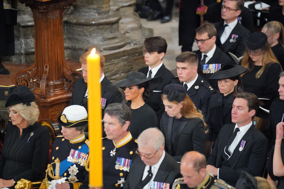 LONDON, ENGLAND - SEPTEMBER 19: Camilla, Queen Consort, Princess Anne, Princess Royal, Prince Harry, Duke of Sussex, Meghan, Duchess of Sussex and Princess Beatrice during the State Funeral of Queen Elizabeth II at Westminster Abbey on September 19, 2022 in London, England. Elizabeth Alexandra Mary Windsor was born in Bruton Street, Mayfair, London on 21 April 1926. She married Prince Philip in 1947 and ascended the throne of the United Kingdom and Commonwealth on 6 February 1952 after the death of her Father, King George VI. Queen Elizabeth II died at Balmoral Castle in Scotland on September 8, 2022, and is succeeded by her eldest son, King Charles III. (Photo by Dominic Lipinski - WPA Pool/Getty Images)