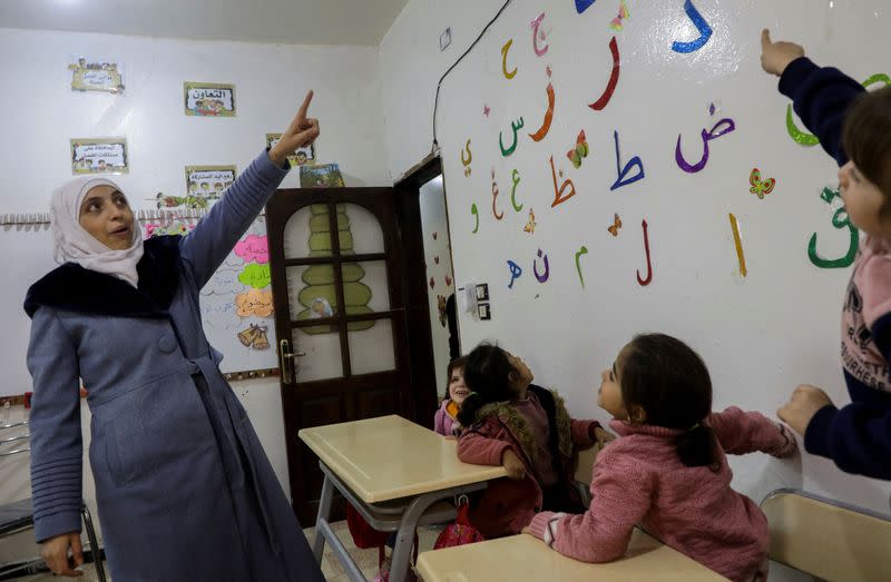 Safaa Kamel, a teacher, takes a class at a school in the northern Syrian town of Afrin