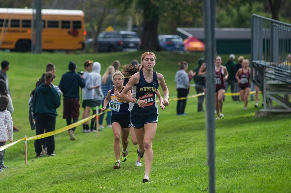 Eventual girls varsity 1 and overall girls winner Katherine Bohlke of Connecticut's Newington High leads runner-up Sloan Wasserman of John Jay-Cross River during the Oct. 8, 2023 Brewster Bear Cross-Country Classic at Brewster High School.