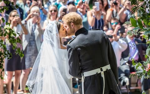 The Hollywood kiss between Meghan Markle and Prince Harry - Credit: Danny Lawson/PA