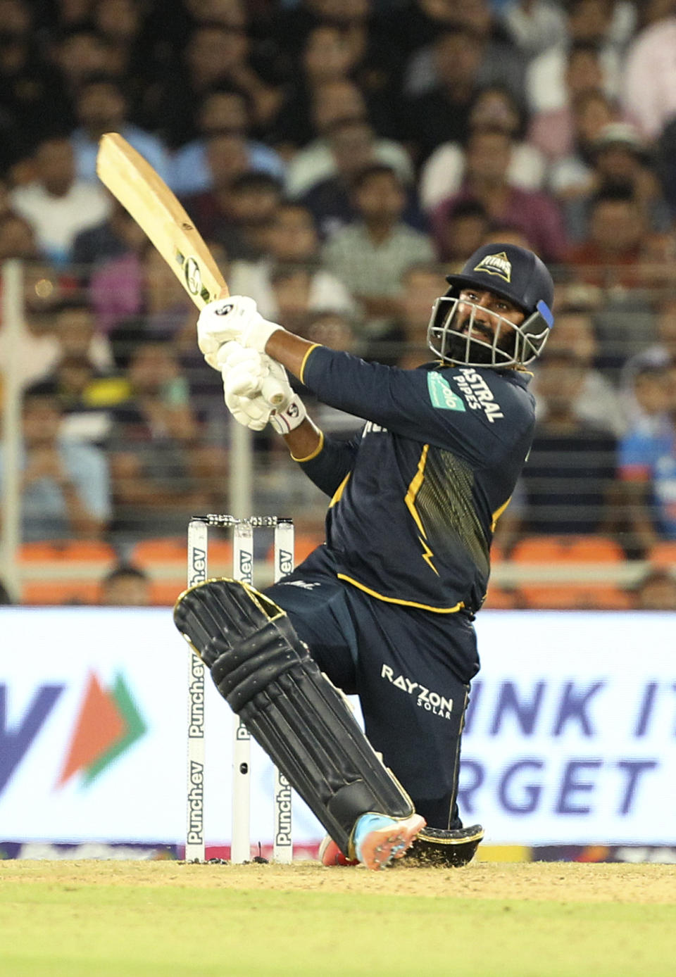 Gujarat Titans' Rahul Tewatia plays a shot during the Indian Premier League cricket match between Gujarat Titans and Punjab Kings in Ahmedabad, India, Thursday, April 4, 2024. (AP Photo/STR)