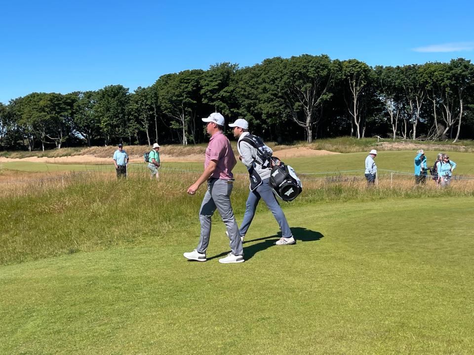 Joel Dahmen and his temporary caddy.