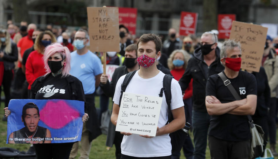 Workers from the event industry protest at Parliament Square in London, Tuesday, Sept. 29, 2020, demanding help for their industry after the shutdown due to the coronavirus outbreak. (AP Photo/Frank Augstein)