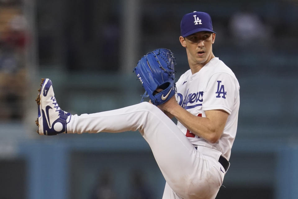 Los Angeles Dodgers starting pitcher Walker Buehler winds up during the first inning of the team's baseball game against the Atlanta Braves on Tuesday, Aug. 31, 2021, in Los Angeles. (AP Photo/Marcio Jose Sanchez)