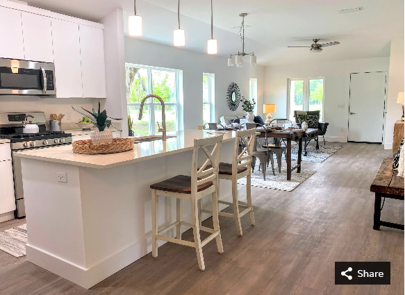 The kitchen, dining and living areas of the Red Maple model home at the Heartwood Subdivision, 1717 SE Eighth Ave., in Gainesville. The neighborhood will have 34 lots when completed, 11 of which will be exclusively used for affordable housing.