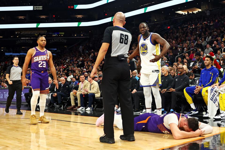 Warriors forward Draymond Green (23) reacts after being called for a foul on Suns center Jusuf Nurkic (20) during the third quarter at Footprint Center in Phoenix on Dec. 12, 2023. Green was ejected.