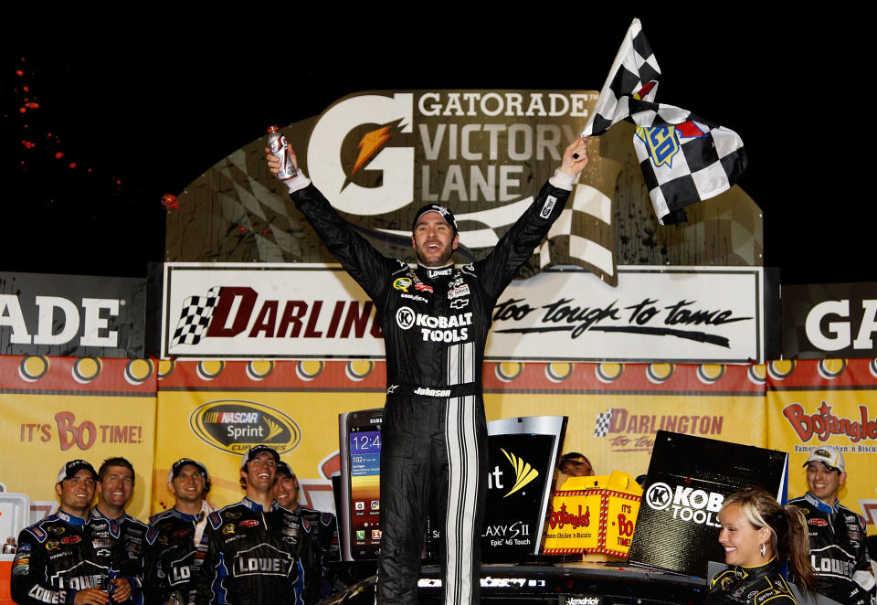 DARLINGTON, SC - MAY 12: Jimmie Johnson, driver of the #48 Lowe's/Kobalt Tools Chevrolet, celebrates in Victory Lane after winning the NASCAR Sprint Cup Series Bojangles' Southern 500 at Darlington Raceway on May 12, 2012 in Darlington, South Carolina. This is the 200th win for Hendrick Motorsports. (Photo by Todd Warshaw/Getty Images)