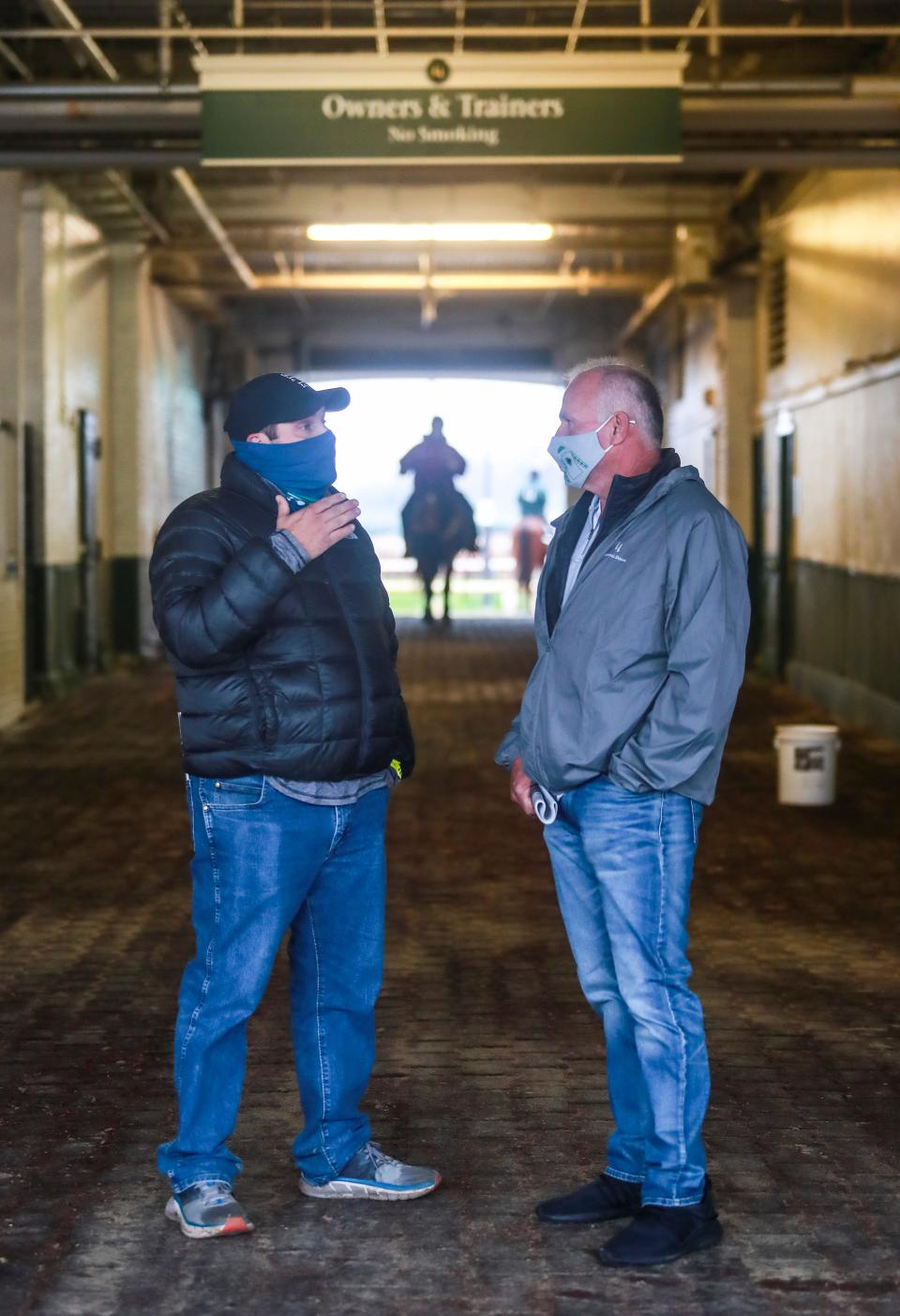 Trainer Brad Cox, left, talks with horse owner Lance Gasaway after a recent race during the Fall Meet at Churchill Downs. Cox, a Louisville native, ranked 4th in both wins and earnings in 2019. Cox's career earnings since 2004 are more than $76 million. Nov. 21, 2020