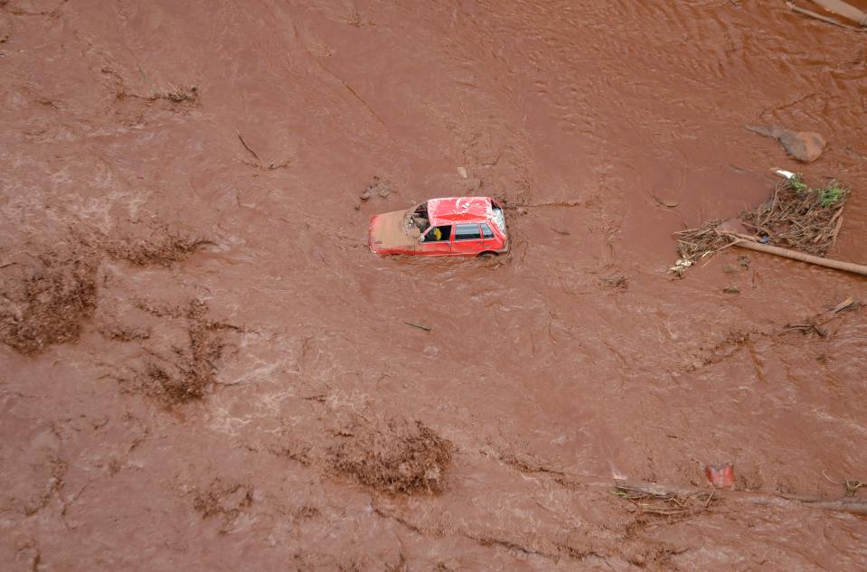 An aerial view shows a destroyed vehicle after a dam collapsed in Brumadinho, Brazil, Saturday, Jan. 26, 2019. Rescuers searched for survivors in a huge area in southeastern Brazil buried by mud from the collapse of dam holding back mine waste, with several people dead and hundreds missing.