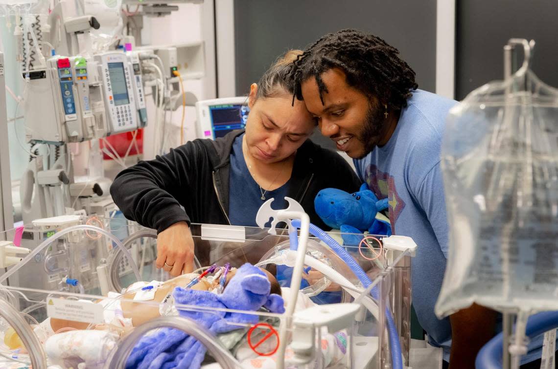 Amanda Arciniega and James Finley, parents of formerly conjoined twin girls, during the day of the surgery to separate them on Monday, January. 23, 2023, at Cook Children’s Medical Center in Fort Worth. Jamie and Amie lay face-to-face and shared a liver, which was successfully separated during the 11-hour procedure.