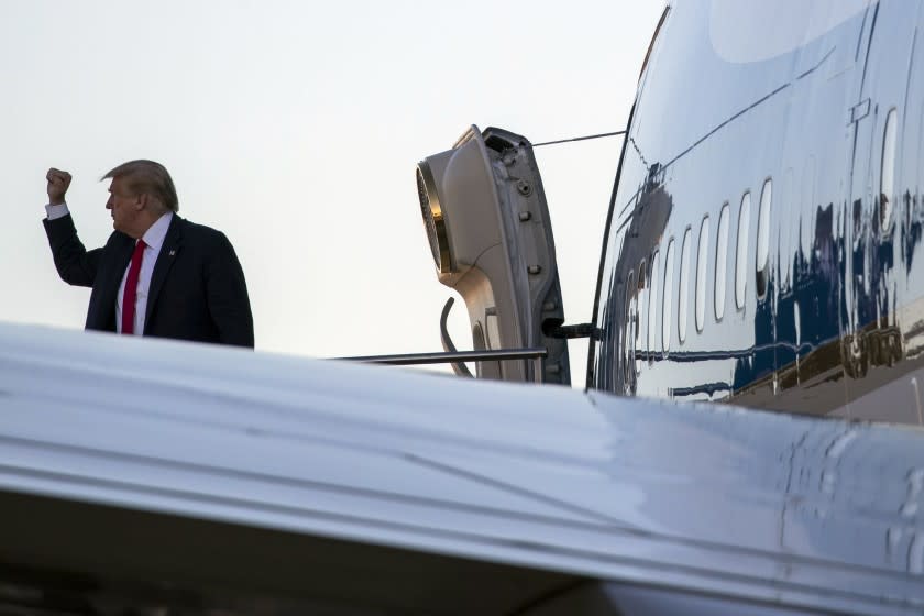 President Donald Trump pumps his fist as he boards Air Force One at Dallas Love Field, Thursday, June 11, 2020, in Dallas.(AP Photo/Alex Brandon)