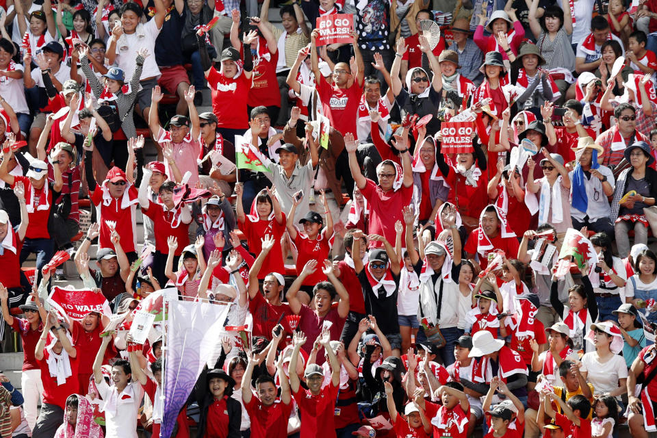 Spectators watch Wales' team training in Kitakyushu, western Japan, Monday, Sept. 16, 2019, ahead of the Rugby World Cup in Japan. (Kyodo News via AP)