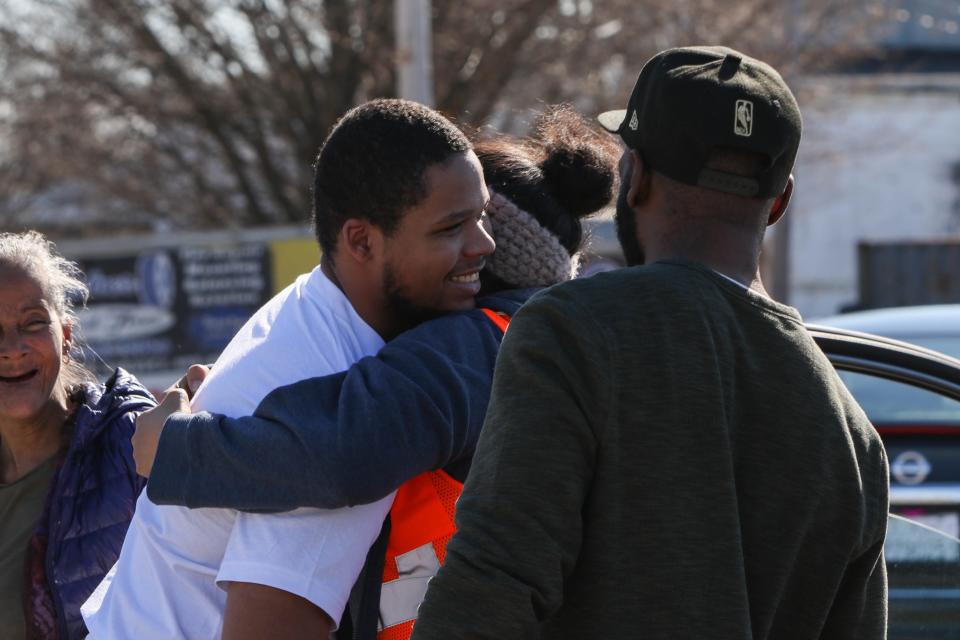 Nineteen-year-old Yahim Harris hugs family after being released from Howard R. Young Correctional Institution on Wednesday, March 4, 2020. The Wilmington teenager was accused of carjacking and then shot by the police during his arrest.