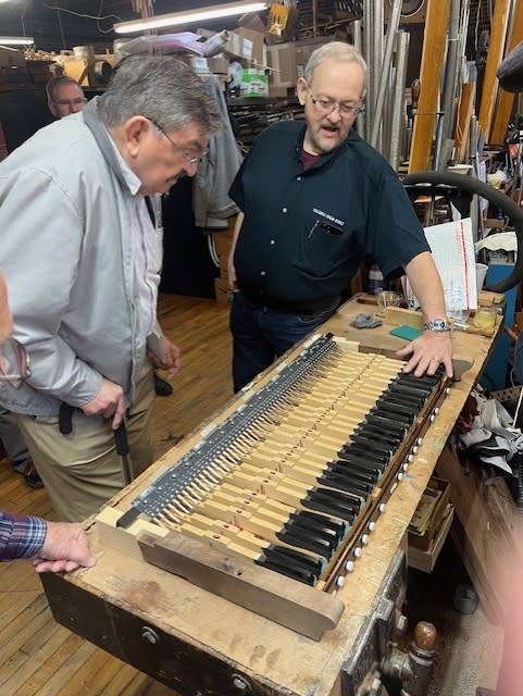 Columbia Organ Works President, Larry Pruett (right) shows progress on the restoration to John Hill Byrne (left). (Photo: First Reformed Church of Lancaster)