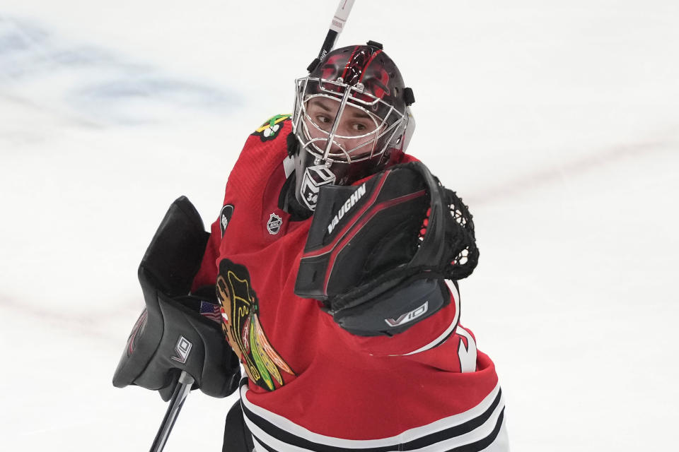 Chicago Blackhawks goaltender Petr Mrazek makes a glove save during the first period of the team's NHL hockey game against the Anaheim Ducks on Thursday, Dec. 7, 2023, in Chicago. (AP Photo/Charles Rex Arbogast)