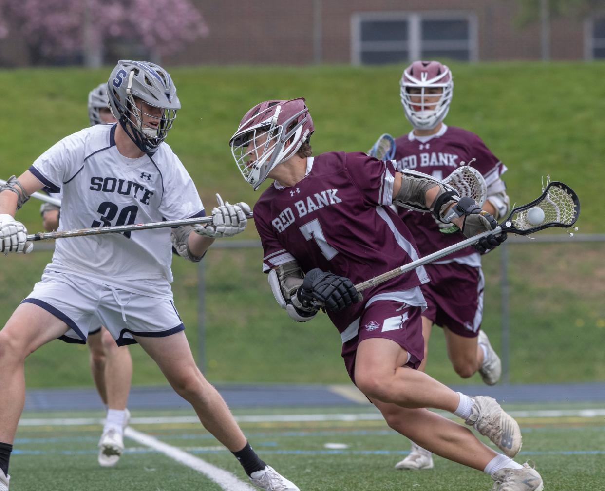 Red Bank Andrew Pape works his way to the boat guarded by Midd South Quinn Beyer. Middletown South Boys Lacrosse vs Red Bank Regional in Middletown, NJ on April 26, 2022. 