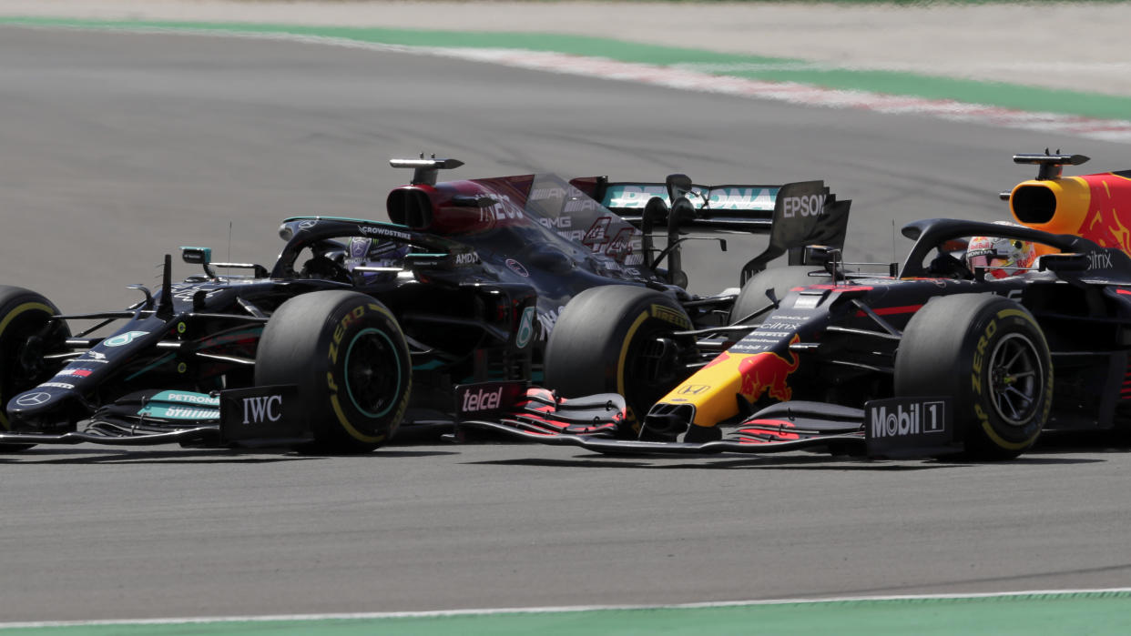 Red Bull driver Max Verstappen of the Netherlands tries to overtake Mercedes driver Lewis Hamilton of Britain, left, during the Portugal Formula One Grand Prix at the Algarve International Circuit near Portimao, Portugal, Sunday, May 2, 2021. (AP Photo/Manu Fernandez)