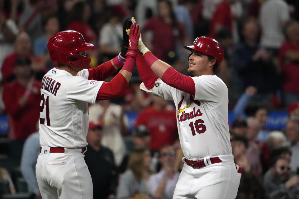 St. Louis Cardinals' Nolan Gorman (16) is congratulated by teammate Lars Nootbaar (21) after hitting a three-run home run during the eighth inning of a baseball game against the Milwaukee Brewers Monday, May 15, 2023, in St. Louis. (AP Photo/Jeff Roberson)