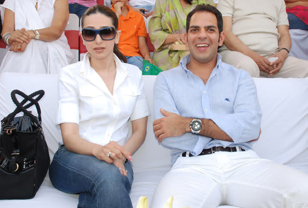 The latest buzz around town is that Karisma's husband Sanjay Kapur has been seen socialising with one particular lady and Lolo, naturally is not happy with it.