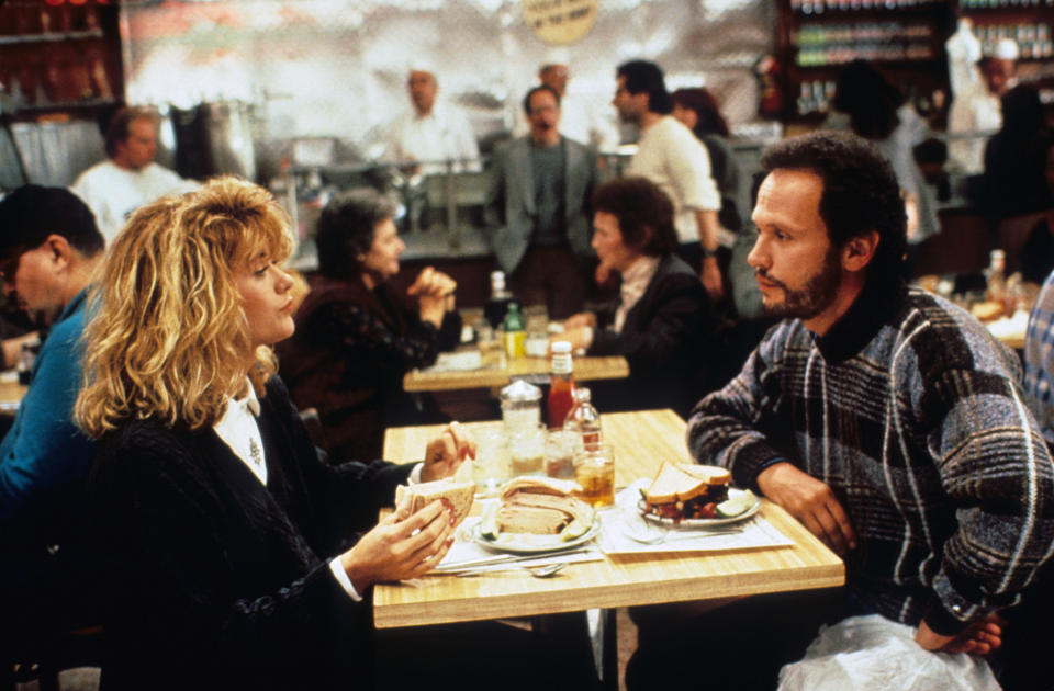 Meg Ryan and Billy Crystal sit across from one another during the "diner scene in When Harry Met Sally"