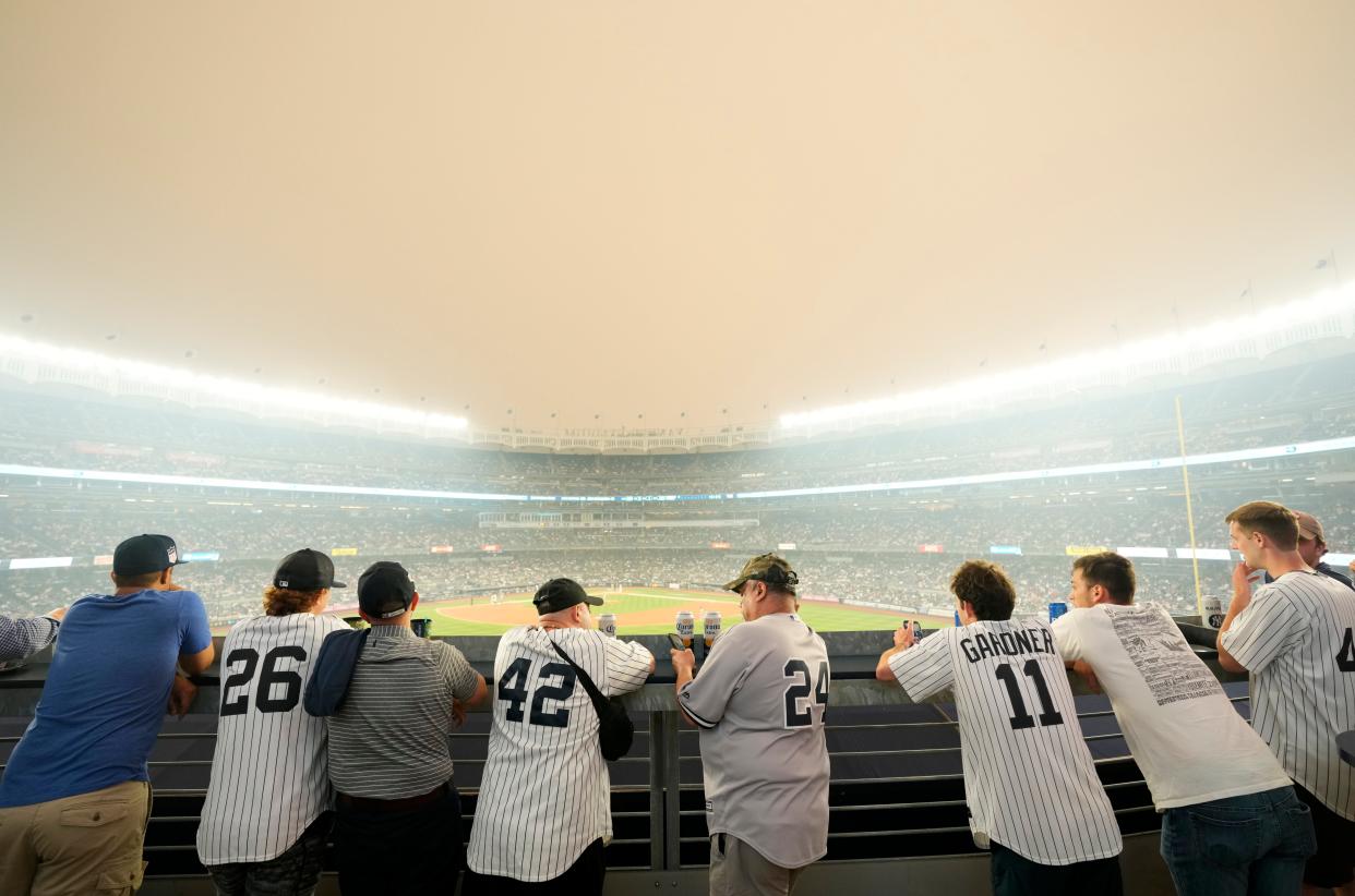 Yankee fans watch the game against the White Sox as a thick haze from the Canadian wildfires hover over The Bronx. Tuesday, June 6, 2023.