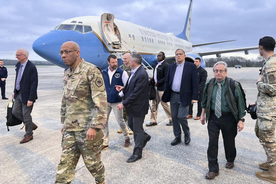 Joint Chiefs Chairman Gen. CQ Brown arrives at Little Rock Air Force Base, Thursday, March 14, 2024, in Little Rock, Arkansas, with Sen. Markwayne Mullin, R-Ok., left, Rep. Bruce Westerman, R-Ark., center, and Sen. John Boozman, R-Ark., right. The chairman is traveling with the lawmakers to visit two weapons facilities in Arkansas and Oklahoma that are producing munitions critical to Ukraine. (AP Photo/Tara Copp)