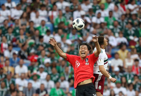 Soccer Football - World Cup - Group F - South Korea vs Mexico - Rostov Arena, Rostov-on-Don, Russia - June 23, 2018 Mexico's Javier Hernandez in action with South Korea's Kim Young-gwon REUTERS/Marko Djurica