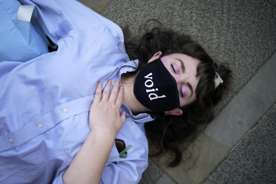 MANCHESTER, UNITED KINGDOM - SEPTEMBER 01: Climate change protesters from Extinction Rebellion perform a 'die-in' outside the government's Department for Work and Pensions (DWP) on September 1, 2020 in in Manchester, United Kingdom. The environmental activist group have organised several events across the UK timed for the return of government officials from the summer holiday. (Photo by Christopher Furlong/Getty Images)