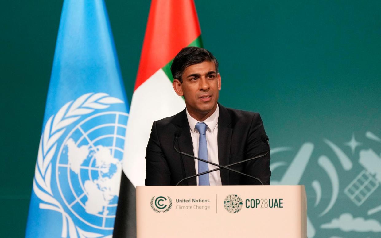 Britain Prime Minister Rishi Sunak speaks during a plenary session at the COP28