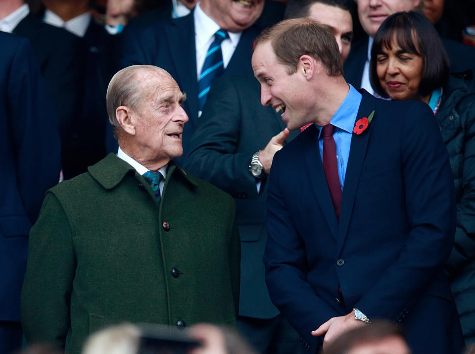 Prince Harry, Prince Phillip and Prince William enjoy the build up to the 2015 Rugby World Cup Final match between New Zealand and Australia at Twickenham Stadium on October 31, 2015 in London, United Kingdom. 