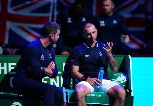 Dan Evans, right, talks with captain Leon Smith 