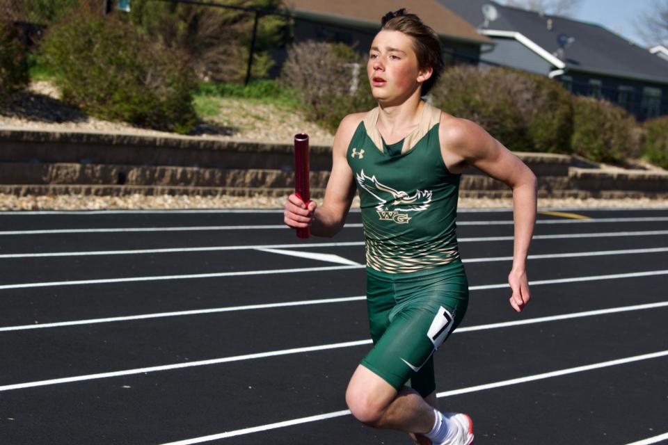 A Woodward-Granger runner competes during the West Central Activities Conference meet on Tuesday, May 2, 2023, in Earlham.