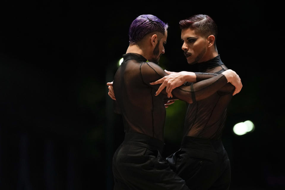 Federico Carrizo and Juan Segui dance while competing in the final round of the stage category during the Tango World Championship in Buenos Aires, Argentina, Saturday, Sept. 25, 2021. "Although all these months that we spent in lockdown at a global level were difficult, especially for cultural workers, personally it helped me to reinforce that this is the profession that I enjoy doing," Carrizo said. "Likewise, I did not stop dancing for a second, in the kitchen, on the street, on the balcony..." (AP Photo/Natacha Pisarenko)