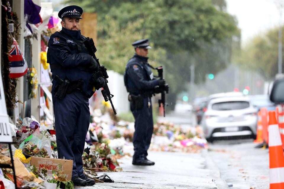 Armed police officers stand guard outside the Al Noor mosque, one of the mosques where some 50 people were killed by a self-avowed white supremacist gunman on March 15, in Christchurch on April 5, 2019. - The man accused of shooting dead 50 Muslim worshippers in a Christchurch mosque sat impassively earlier on April 5 as a New Zealand judge ordered him to undergo tests to determine if he is mentally fit to stand trial for murder.