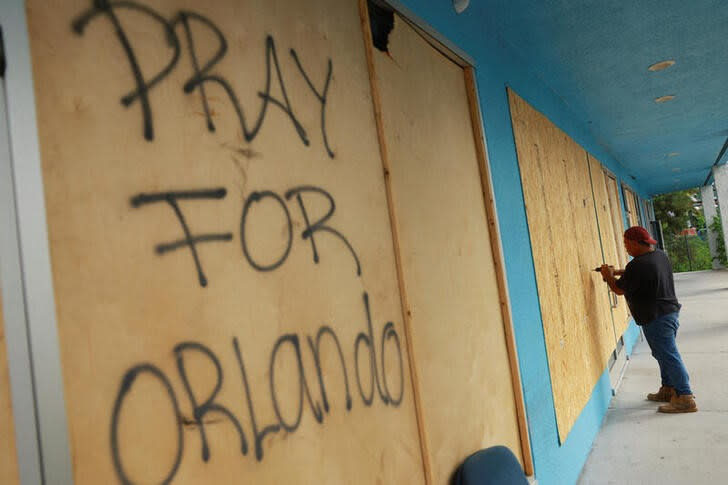 A ’Pray for Orlando’ message is written on wood that was placed at a Home Depot before the arrival of Hurricane Milton, in Orlando, Florida. (Reuters)