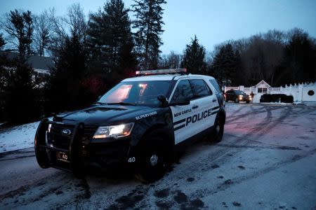 Police vehicles are seen outside the home of former U.S. President Bill Clinton and former Democratic presidential candidate Hillary Clinton after firefighters were called to put out a fire at the property in Chappaqua, New York, U.S., January 3, 2018. REUTERS/Mike Segar