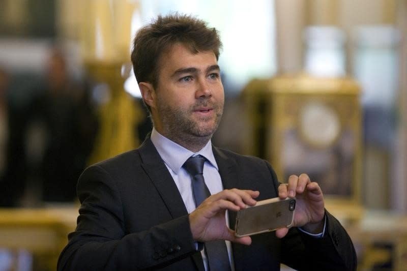 Frederic Mazzella, French founder and CEO of BlaBlaCar, takes a picture with his mobile phone as he attends the